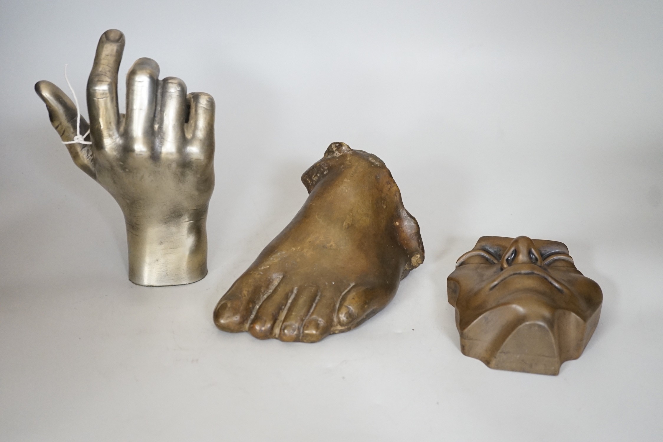 A limited edition life size bronze foot and two resin parts